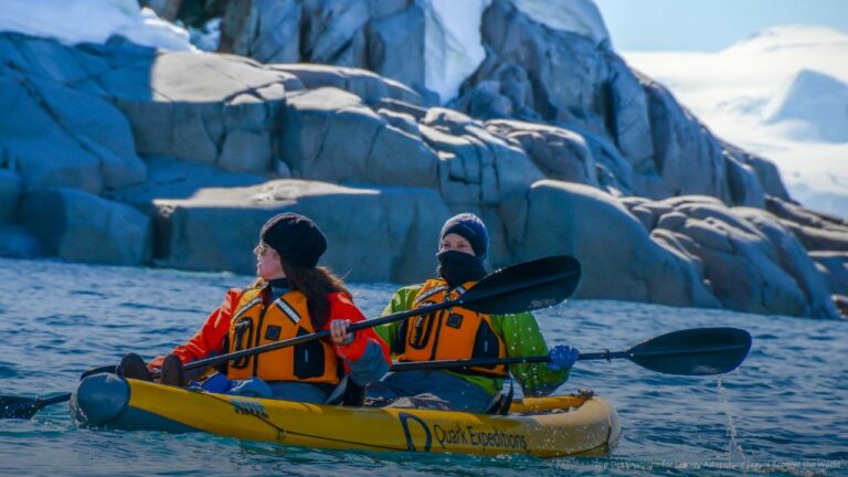 People Kayaking in Arctic Area